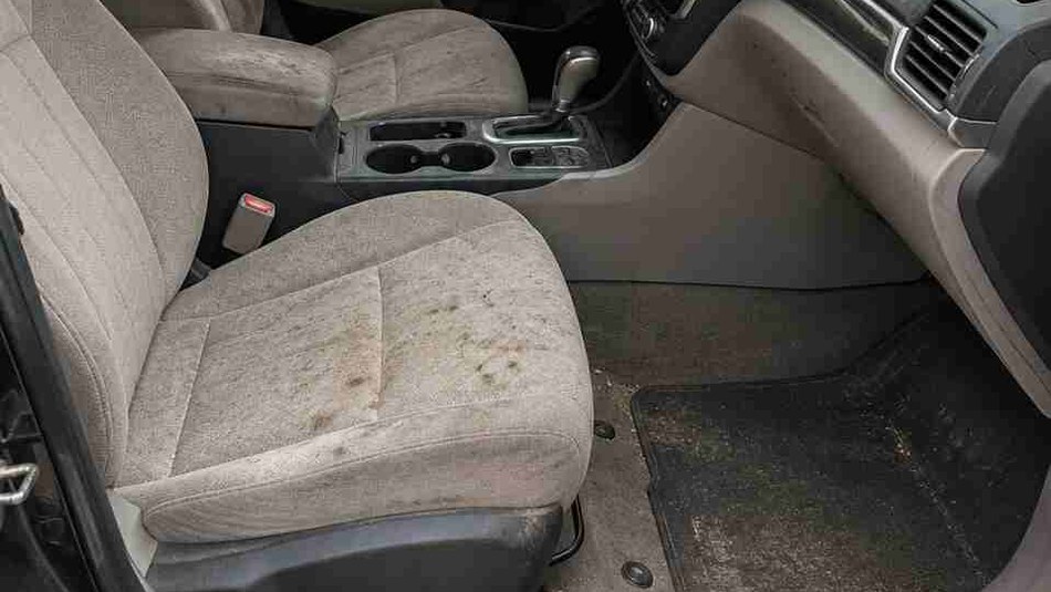 Car interior before detailing — dirty seats and floor